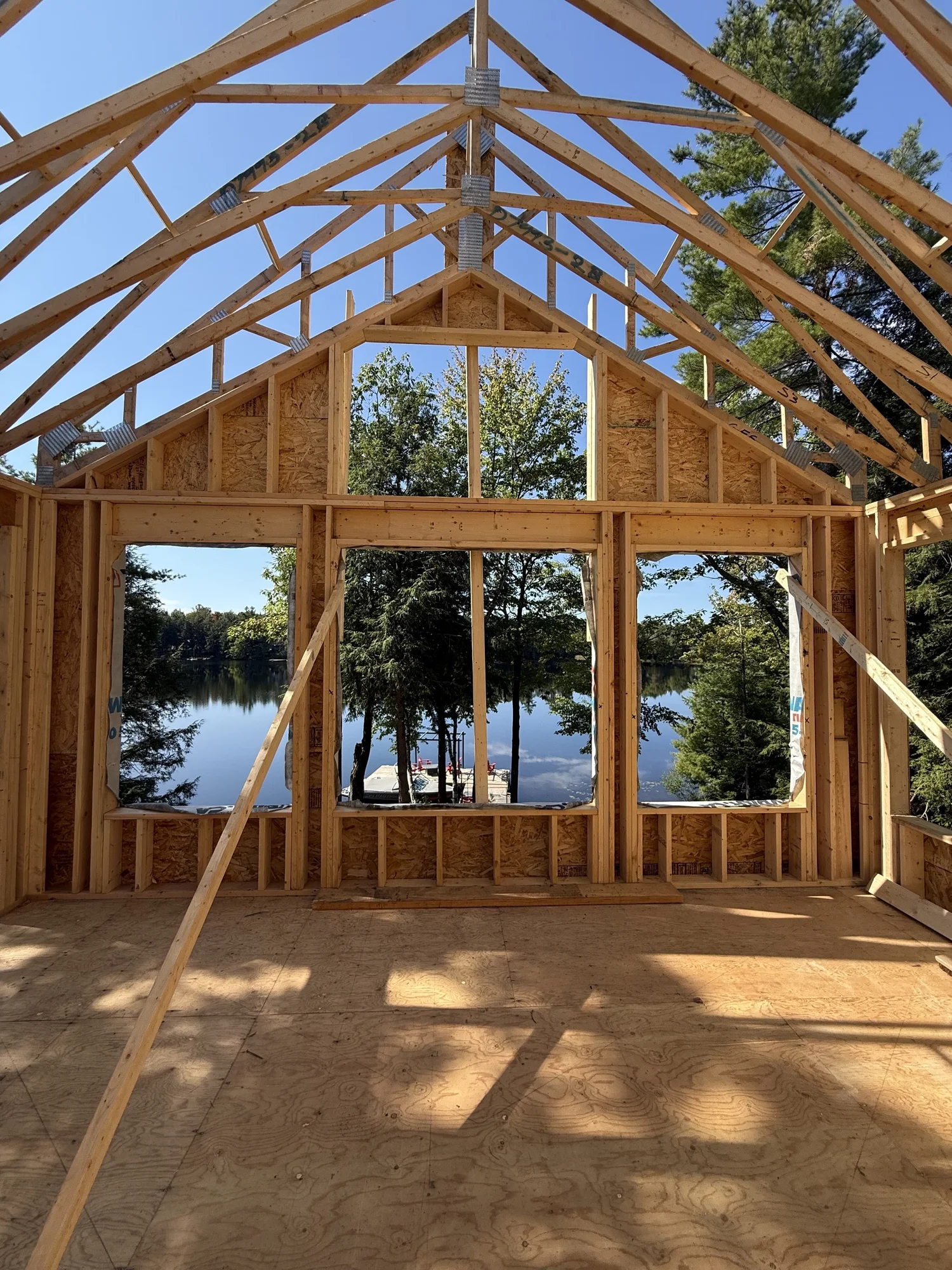 Timber cottage framing looking toward the lake